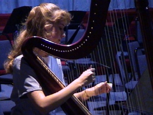 Young lady playing harp